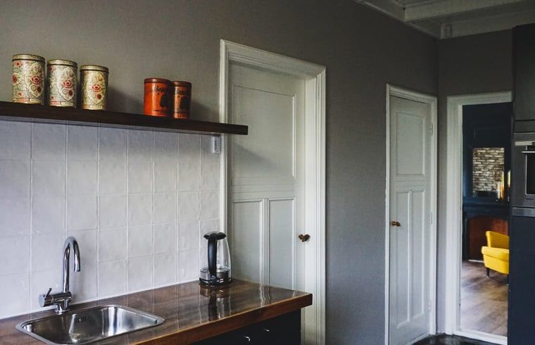 Kitchen Corner in Holiday Home in Garyp, Friesland, with convenient storage and appliances.