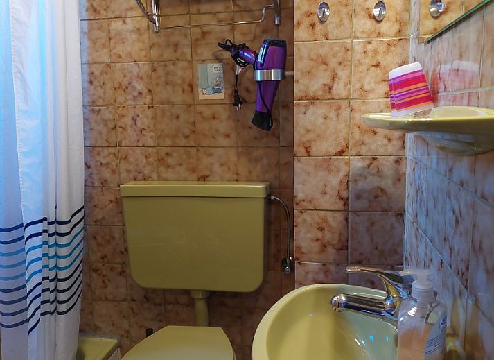 Gezellige woonkamer van Ferienhaus Mariechen met sauna in Holtgast, Nedersaksen. Comfortabel vakantiehuis in Oost-Friesland.