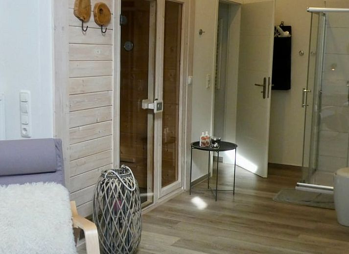 Enjoy the serene nature surrounding the Holiday Home in Murlenbach, Eifel, with stunning views of green fields and trees.