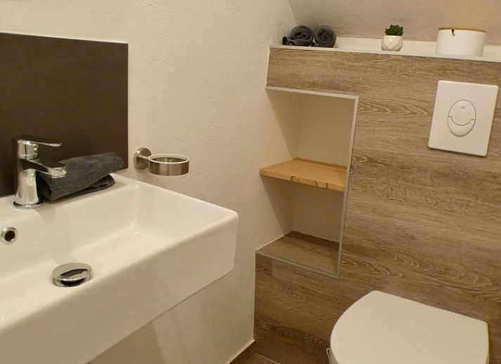 Enjoy the serene nature surrounding the Holiday Home in Murlenbach, Eifel, with stunning views of green fields and trees.