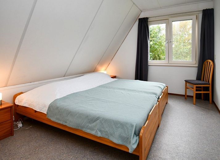 De Grutto, vakantiehuis op Terschelling, met charmante architectuur en serene ligging in Midsland Noord.