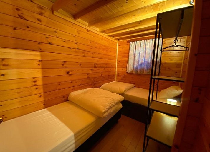 Chalet 't Musje in Weris, Ardennen, Belgie met groene tuin en terras voor ontspanning.