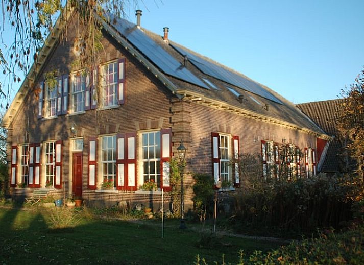 Vakantiehuis in De Steeg omgeven door uitgestrekte velden in Veluwe, Gelderland.