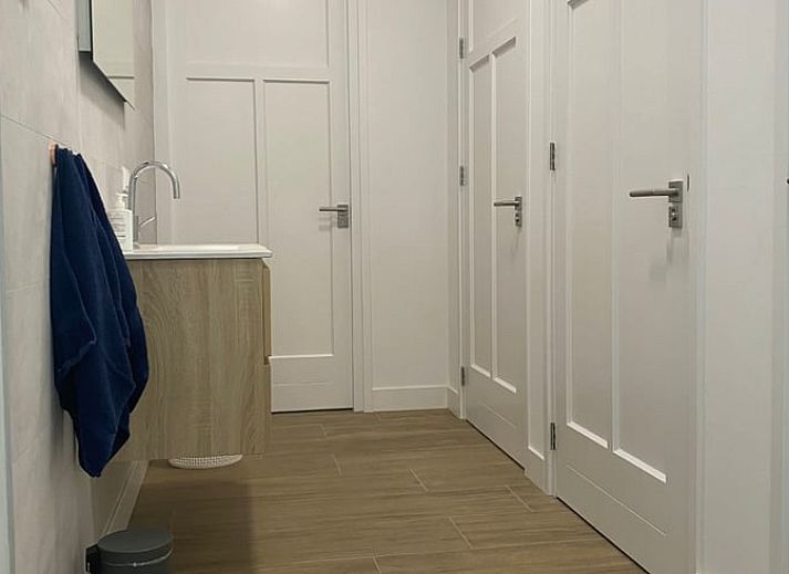 Prachtig uitzicht vanaf het terras van Huisje in Beers, vakantiehuis in Beers NB, omgeven door groene velden.