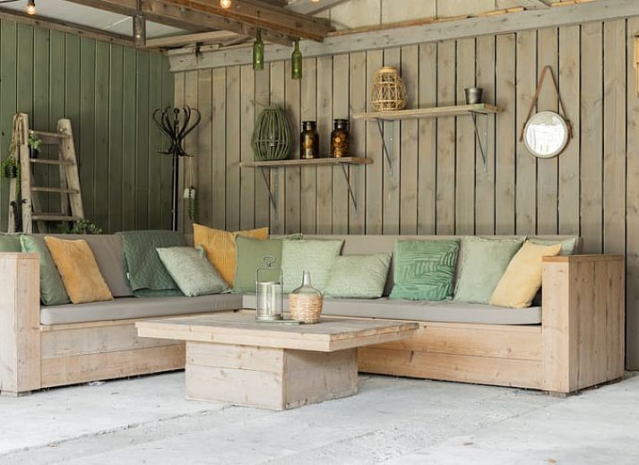 Enjoy a relaxing moment on the terrace of Cottage in Opperdoes, vacation home on the IJsselmeer coast, North Holland.