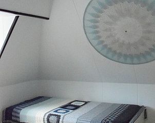 Extra bed in slaapkamer van 't Achterhuis vakantiehuis, Oudeschild, Texel.