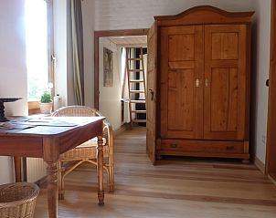 Gezellige binnenruimte in Vakantiehuis in Syke, Nedersaksen met houten interieur en rustieke sfeer.