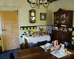 Cozy dining room in Holiday home in Onkerzele, Geraardsbergen, with authentic details in East Flanders, Belgium.