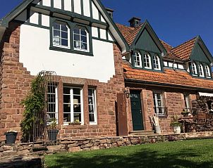 Charming vacation home in Mrlenbach, Eifel, Germany, with beautiful stone facade and classic architecture.