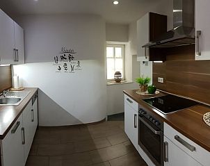 Modern kitchen in Holiday Home in Pltscheid, Eifel, with stylish furnishings and natural light.
