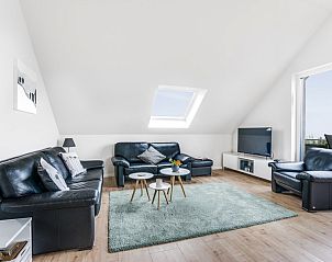 Cozy living room of Ferienwohnung Panoramablick in Nickenich Laacher See, Eifel with modern interior and beautiful views.