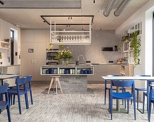 Gezellige eetruimte in Gare 55 vakantiehuis Ertvelde, Oost-Vlaanderen, met moderne meubels.