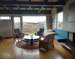 Spacious living room overlooking the dunes in The Helmhoeve vacation home, Midsland aan Zee, Terschelling.