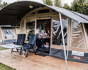 Camping Gritt Lodge de Luxe in Ingeldorf Erpeldingen, Luxembourg offers a cozy glamping experience with a spacious veranda.