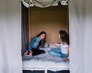 Cozy bedroom at Camping Gritt Lodge, Ingeldorf Erpeldingen, Luxembourg. Perfect for a relaxing glamping experience.