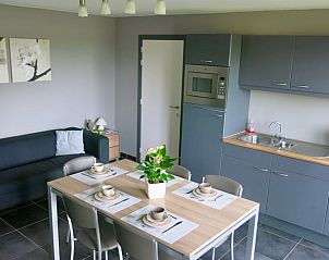 Modern kitchen and dining area in Cottage in Brecht, vacation home in Brecht, Antwerp, ideal for cozy meals.