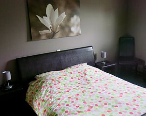 Comfortable bedroom in Huisje in Brecht, a vacation home in Brecht, Antwerp, with stylish interior.