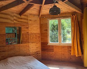 Cozy cottage in Saignon overlooking green nature from the terrace, located in Provence, France.