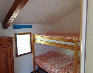 Cozy bedroom with bunk beds in Gte du Lion, vacation home Figeac, Midi-Pyrenees, France.
