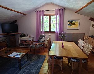 Cozy living room in Gte du Lion, vacation home in Figeac, Midi-Pyrnes, France with wooden interior and natural light.