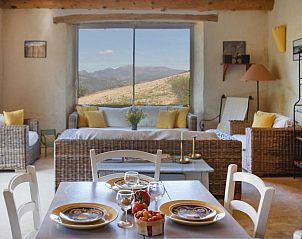 Cozy living room in Le Serre des Granges Maxx vacation home, Montaulieu, Rhone-Alphes with beautiful mountain views.