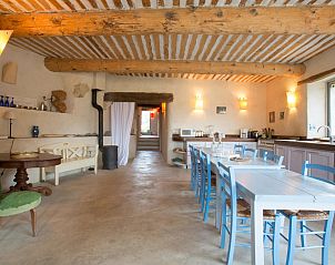 Spacious kitchen of vacation home Le Serre des Granges Maxx in Montaulieu, Rhne-Alpes, with rustic wooden beams and modern amenities.
