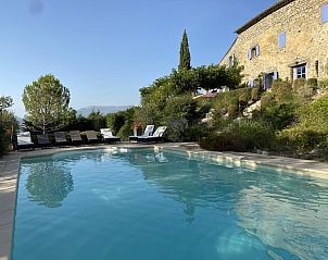 Relax by the pool at Le Serre des Granges, a charming vacation home in Montaulieu, Rhne-Alpes, surrounded by beautiful nature.