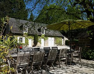 Enjoy the peace and quiet on the terrace of Domaine de Migoule, a charming vacation home in Brive-la-Gaillarde, Aquitaine, France.
