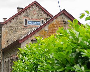 Ferienhaus in Purnode, ein charmantes Ferienhaus in den Ardennen, Belgien, umgeben von grner Natur und rustikaler Architektur.