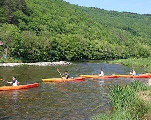 Kayaking on the river near Holiday cottage in Alle, Ardennes, surrounded by lush nature in Namur, Belgium.