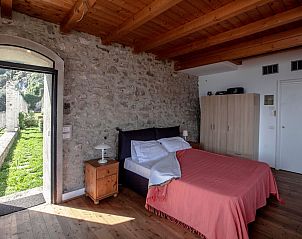 Guest house 08922654 - Apartment Italian Lakes - Appartement Kumquat Studio mit Garten- und Seeblick