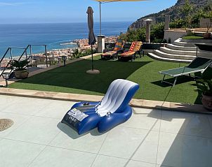 Enjoy breathtaking views from the terrace of vacation home Maestrale in Cefal, Sicily, with the sea and mountains in the background.