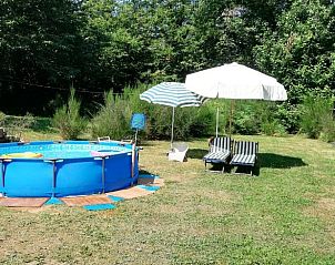 Relax by the pool of Holiday Home in Mulazzo, Tuscany, Italy, surrounded by green nature.