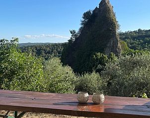 Enjoy stunning mountain views from the terrace of Cottage in Roccalbegna, a vacation home in Tuscany, Italy.