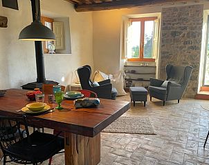Cozy living room of Cottage in Roccalbegna, Tuscany, with rustic furnishings and views of nature.