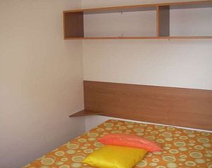 Cozy bedroom in luxury mobile home, Assisi, Umbria, Italy, perfect for a relaxing vacation stay.