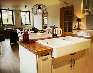 Modern kitchen in Cottage in Torgny, cottage in the Ardennes, with stylish decor and lots of natural light.