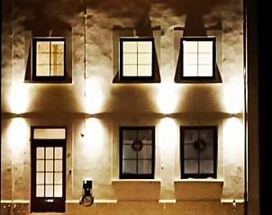 Night view of Cottage in Torgny, cottage in the Ardennes, with atmospheric lighting and rustic charm.