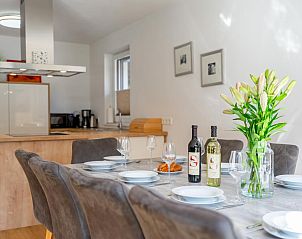 Stylish dining room in vacation home JooP, Niedernsill, Salzburg, with modern furnishings and cozy atmosphere.