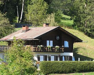 Chalet Helena in Ktschach-Mauthen, Carinthia offers a rustic vacation home surrounded by lush nature and serene mountain scenery.