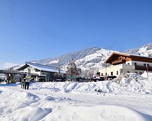 Next To The Skilift A 6, Ferienhaus in Brixen am Thale, Tirol, mit herrlichem Blick auf die schneebedeckten Berge und direktem Zugang zum Skilift.