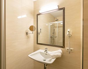 Modern bathroom in Bergjuwel Typ 2, vacation home in Fgen im Zillertal, Tyrol, with luxury shower and elegant sink.