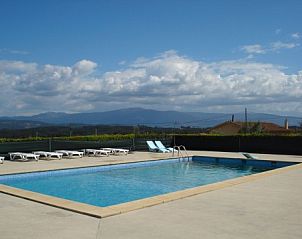 Enjoy the pool at Portucampo apartment in V.N. de Poiares, Alentejo, Portugal with beautiful mountain views.