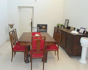 Cozy dining room in Cottage in Montefrio, Andalusia, with rustic wooden furniture for an authentic Spanish experience.