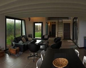 Discover the modern interior of Les Prs Sals, a vacation home in Fermanville, Lower Normandy, with spacious living room and kitchen.