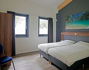 Knusse slaapkamer in Marinushoeve vakantiehuis in Havelte met uitzicht op de natuur van Zuidwest Drenthe.