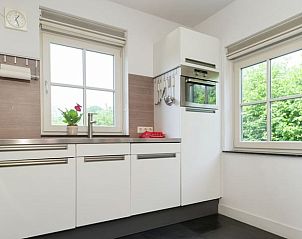 Bright kitchen overlooking the garden in Cottage in Hollandscheveld, Southwest Drenthe.