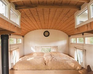 Cozy bedroom with wooden ceiling in Holiday home in Nieuwehorne, Friesland.