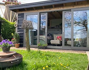 Moderne buitenruimte van Huisje in Zoelen, vakantiehuis in Rivierengebied, Gelderland.