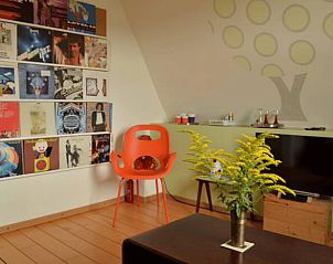 Cozy living room in Holiday Home in Melick, Central Limburg with colorful decoration and seating area.